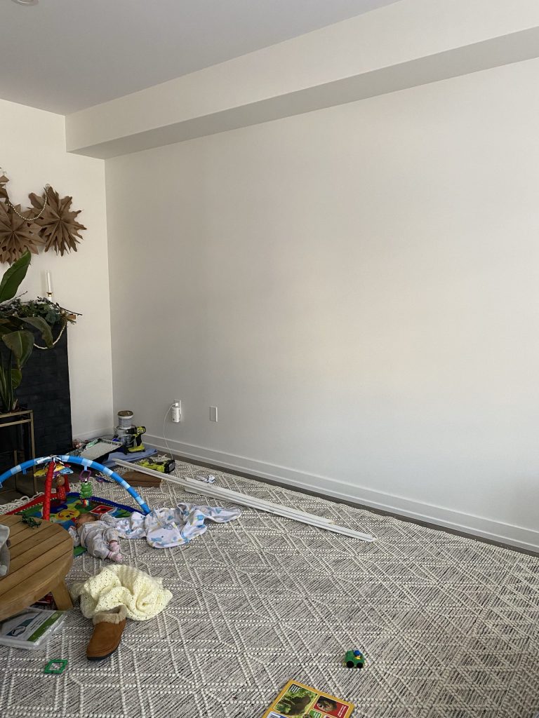 A blank living room wall ready for an accent wall