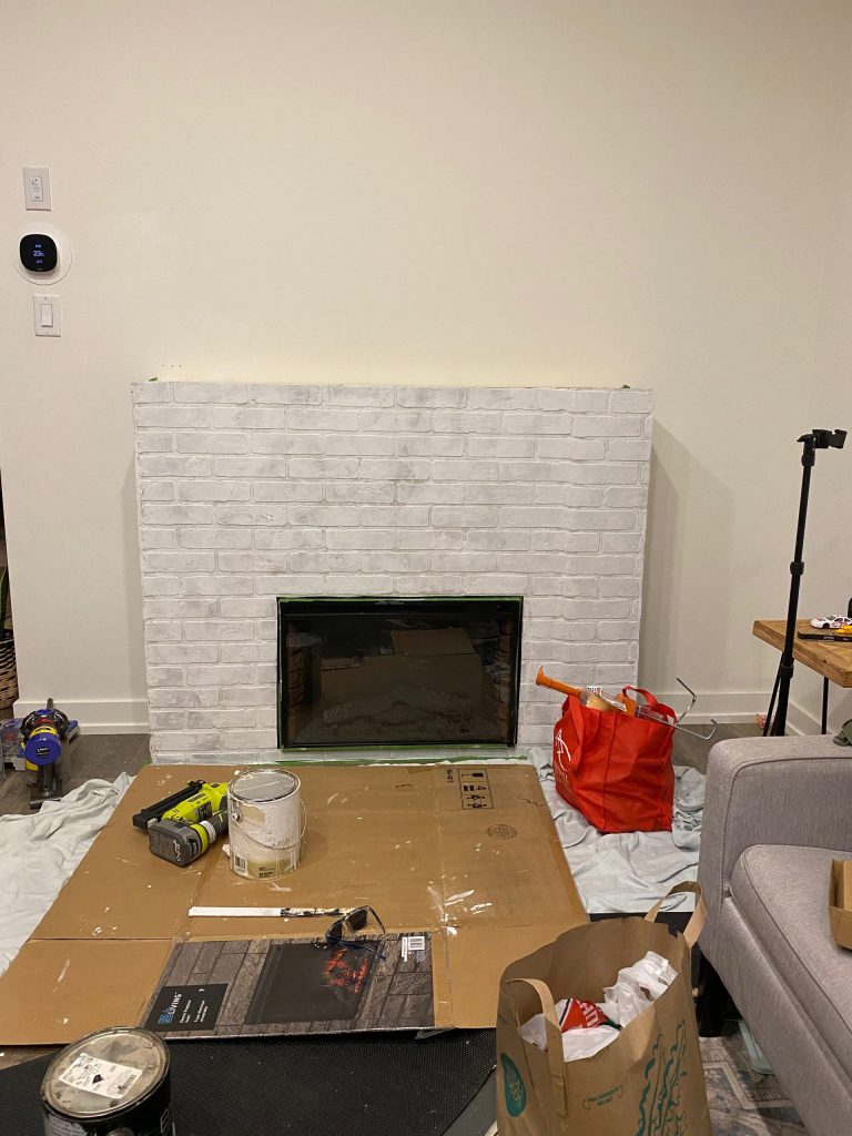 Added faux brick paneling to my faux fireplace