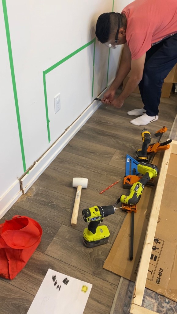 Removing the baseboards to fit the electric fireplace frame