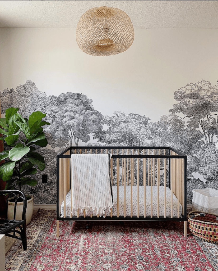 vintage inspired nursery with vintage rug and wall mural