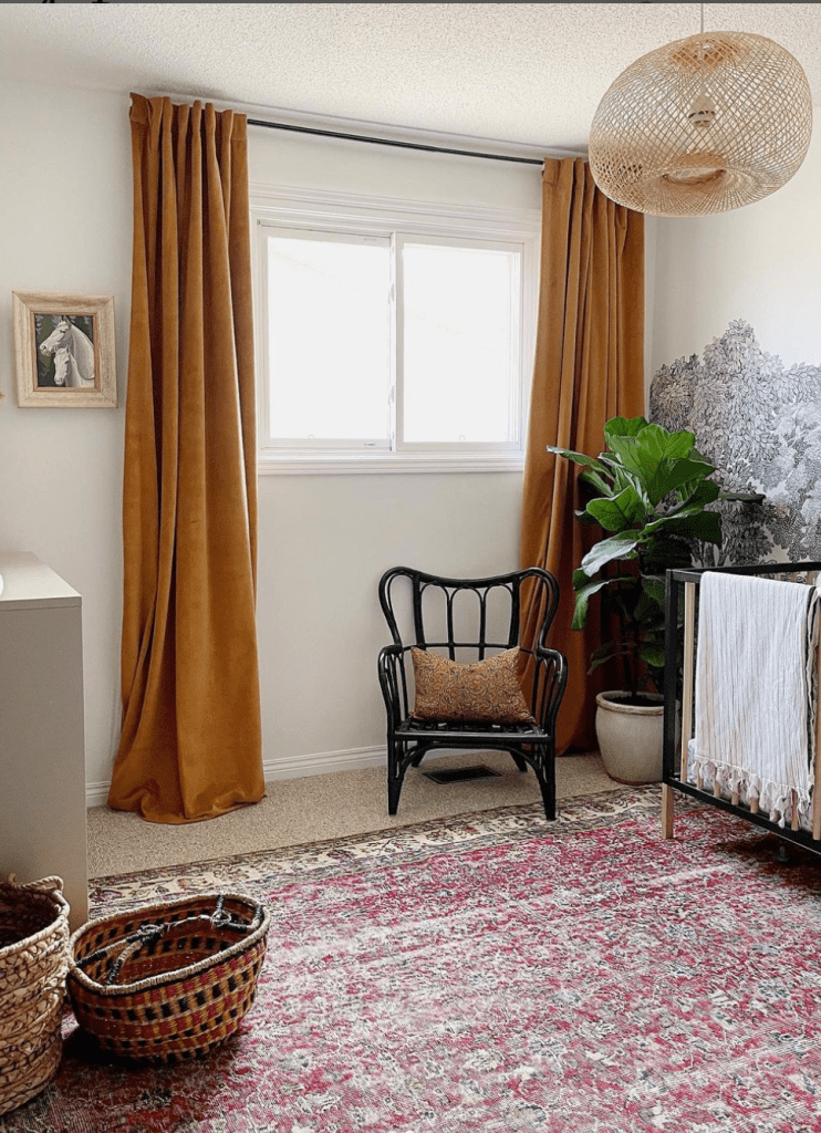 vintage inspired nursery with vintage rug and wall mural