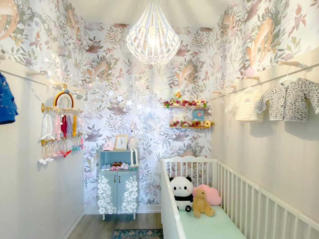 Woodlands Baby girl nursery with white beaded chandelier 