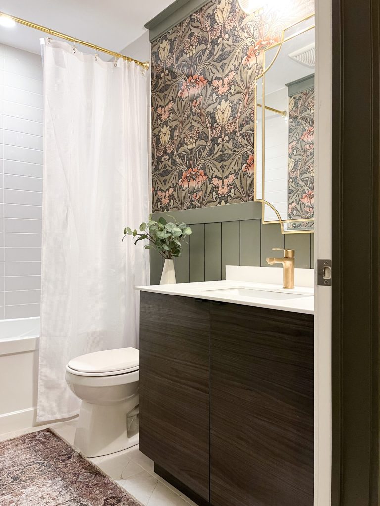 Moody bathroom with wallpaper and shiplap