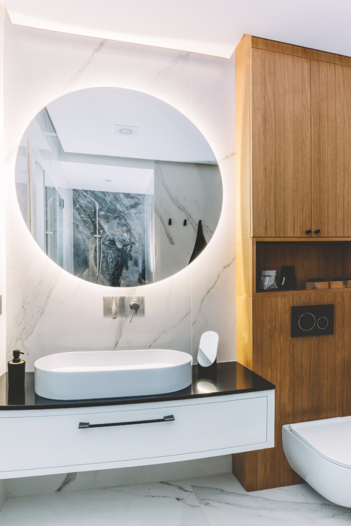 modern bathroom in 2024 with round mirror with led light illumination